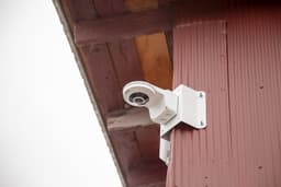 Radius mounted on a corner by using the Outdoor Wall Mount (WMN26P) and the Corner Mount Bracket (CMB26ZV)