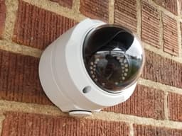 A Sheriff mounted on a brick wall with the electrical box mount.