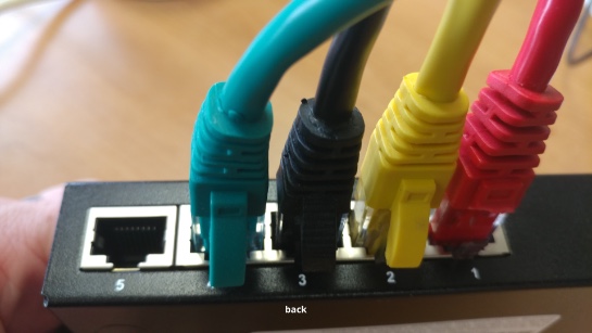 4 ip cameras plugged into switch - front