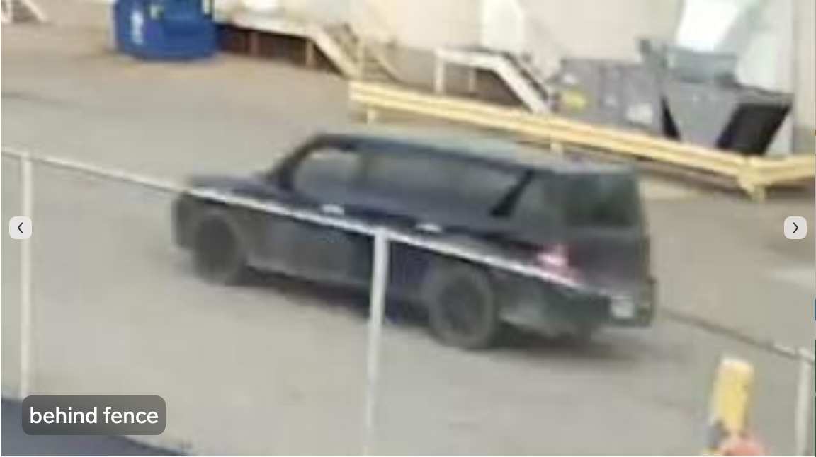 vehicle behind fence